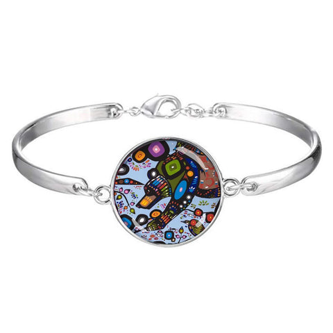 John Rombough Bear Dome Glass Bracelet – adjustable bracelet with glass dome featuring Indigenous bear design symbolizing strength and protection.