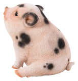 Pet Pals chubby pink piglet sitting statue with black spots made from polyresin for indoor and outdoor home and garden décor.