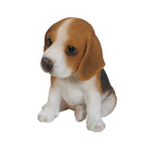 Realistic sitting Beagle puppy statue made from polyresin, featuring lifelike details for garden, patio, lawn, home, or office décor.
