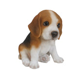 Realistic sitting Beagle puppy statue made from polyresin, featuring lifelike details for garden, patio, lawn, home, or office décor.
