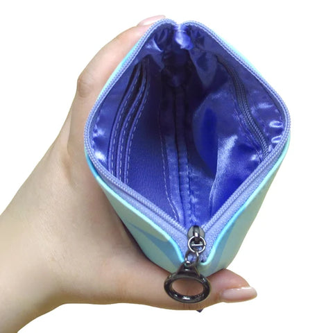 Michelle Stoney Healing Feather coin purse featuring Gitxsan Indigenous artwork with three card slots and RFID protection.