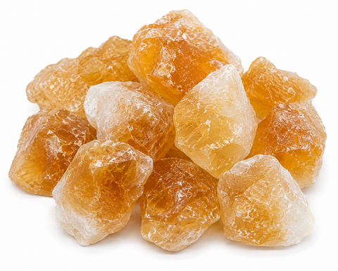 Natural rough Citrine crystal stones in golden yellow and amber tones on white background