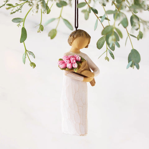 Willow Tree Bright Hope Ornament holding a star with hanging cord.