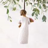Willow Tree Bright Hope Ornament holding a star with hanging cord.