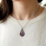 Emily Kewageshig A Skirt with a Story Gallery Collection necklace featuring Anishinaabe ribbon skirt artwork.
