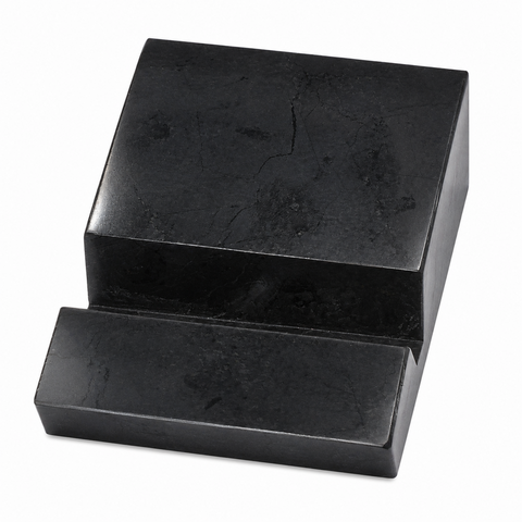 Polished AAA-grade Russian shungite phone stand on a white background
