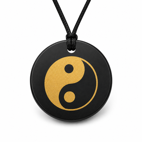 Russian shungite round pendant with gold yin yang design and black cord