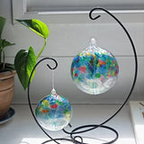 Close-up of Tree of Family hand-blown glass ornament showing colourful glass leaves