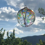 Hand-blown Tree of Friendship glass ornament featuring detailed internal branches