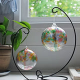 Close-up of Tree of Friendship hand-blown glass ornament showing colourful glass leaves